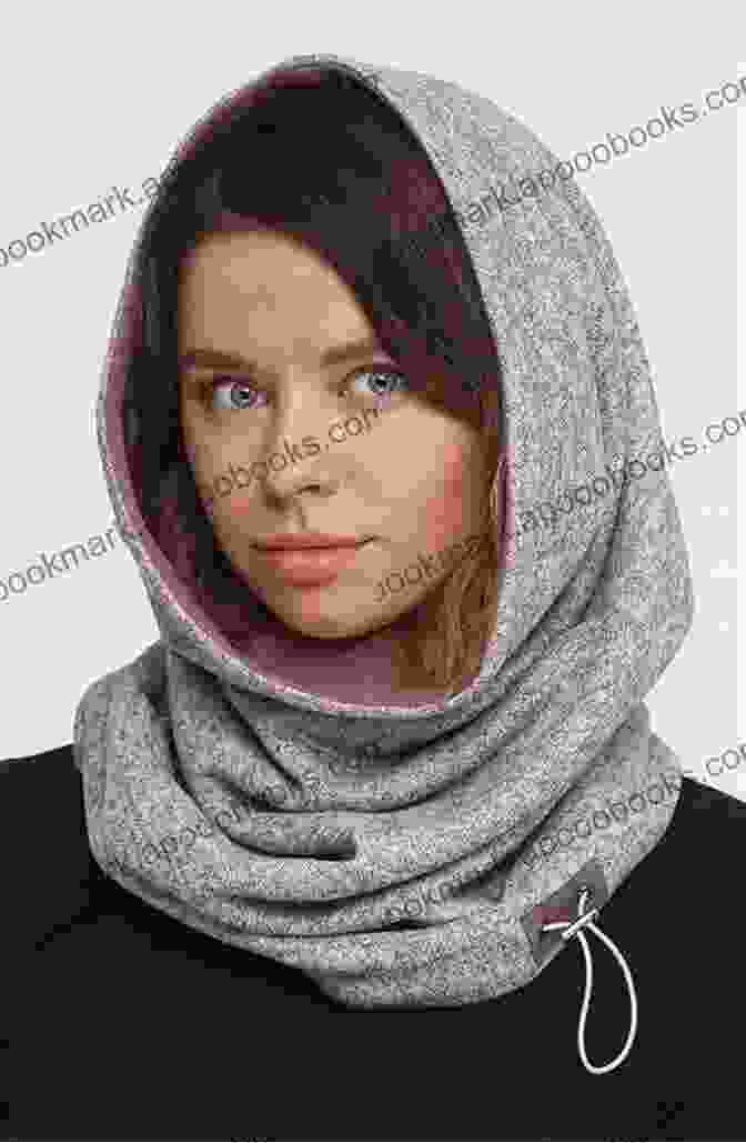 A Woman Wearing A Crocheted Woolen Hooded Scarf In A Snowy Winter Scene, Embracing Both Warmth And Style Simple Crocheted Hooded Scarves: Woolen Hooded Scarves For Crochet Lovers: Woolen Hooded Scarves